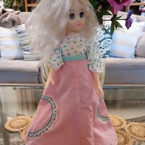 Elegant Pink and White Doll with Floral Dress